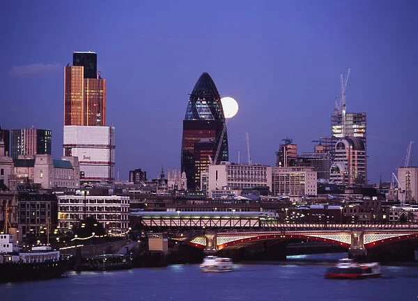 Looking Down The Thames At Dusk To Full Moon Rising Behind The Swiss Re Building