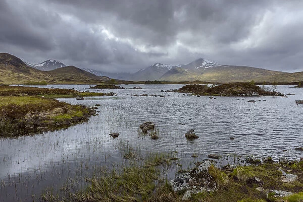 Moor landscape with a river and storm clouds at Rannoch Moor in Scotland, United Kingdom