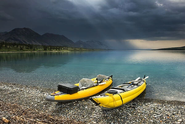 A Pair Of Yellow Inflatable Kayaks On The Lower Twin Lake Beach With A Summer Thunderstorm In The Background, Lake Clark National Park & Preserve, Southcentral Alaska