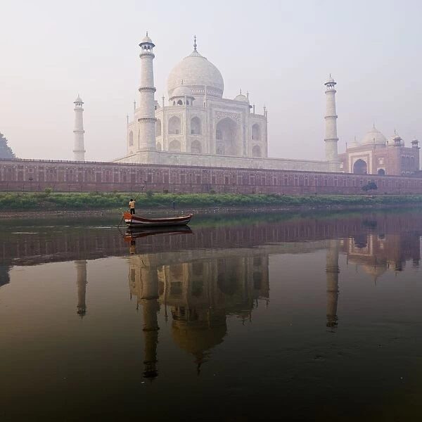 Person In Boat In Front Of Taj Mahal; Agra, India