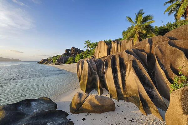 Rock Formations and Palm Trees near Sunset, Anse Source d┼¢Argent, La Digue, Seychelles