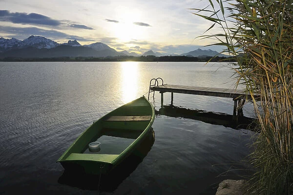 Rowboat with Sun Reflecting on Lake, Hopfen am See, Lake Hopfensee, Bavaria, Germany
