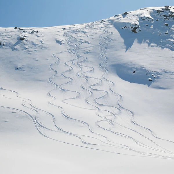 Ski tracks in the snow on a mountain; Zermatt valais switzerland