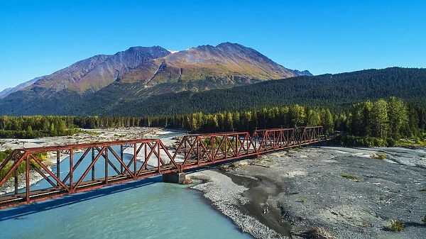 Snow River with train trestle, Alaska, USA