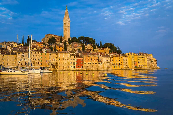 Sun reflecting on the buildings of the fishing port city of Rovinj on the north Adriatic Sea in Istria, Croatia