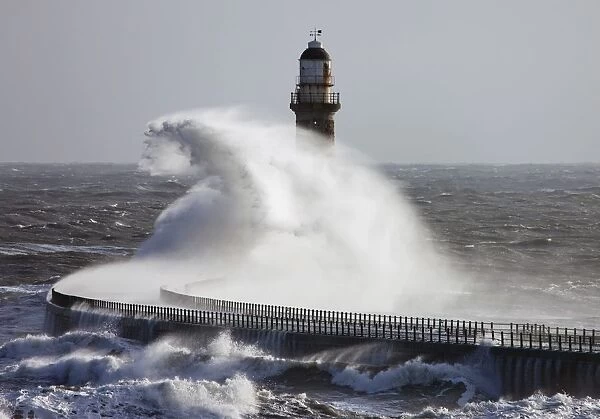 Sunderland, Tyne And Wear, England; Waves Crashing Into A Pier And Lighthouse