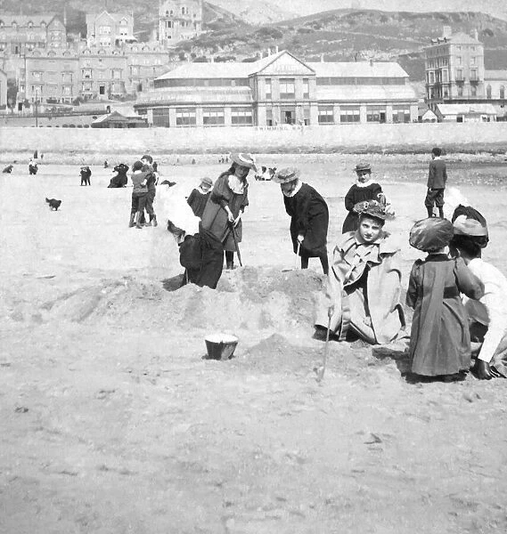Victorian Stereoview card from circa 1900 for viewing thought a stereoscope. Playing on the beach in 1894. Children playing on Llandudno beach wales