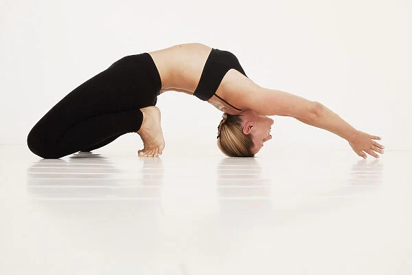 A woman in a yoga pose; Tarifa cadiz andalusia spain