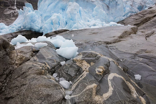 end of Nigardsbreen glaciar with ice on rocks, Nigardsbreen, Norway