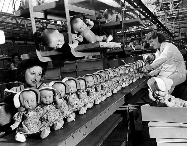 Some of these 1947 dolls for your children are coming off the moving belt