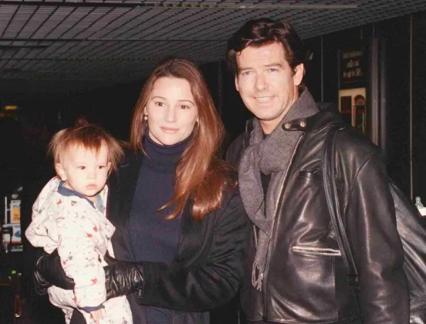 Actor Pierce Brosnan and girlfriend Keeley Shay Smith with baby Dylan Thomas arriving at