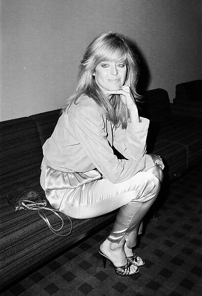 US actress Farrah Fawcett Majors, poses for photographers after news press conference in