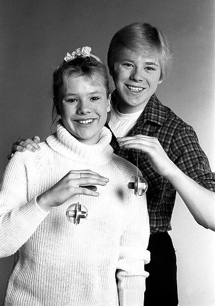 Actress Letitia Dean with brother Stephen try out new yo yos. January 1982