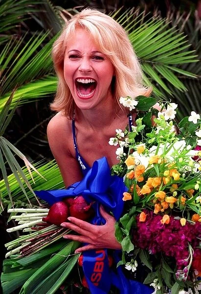 Actress Miranda Burrows at Chelsea flower show May 1997 holding boquet of flowers