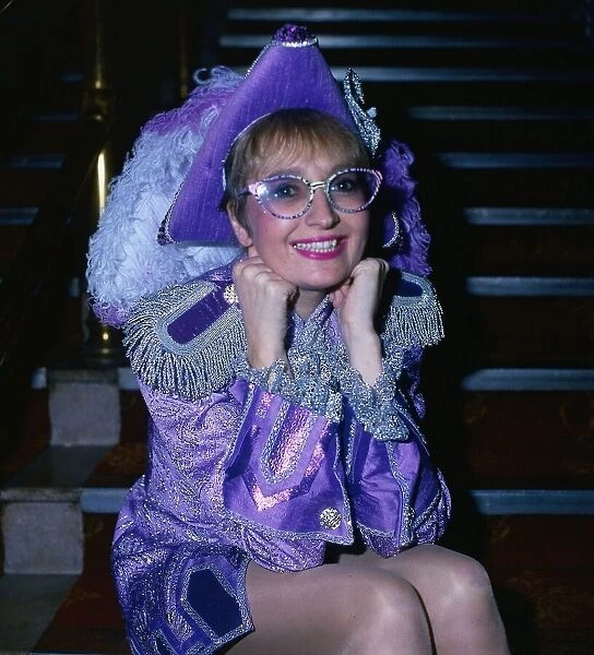 Actress Sue Pollard December 1985 wearing lilac outfit and hat