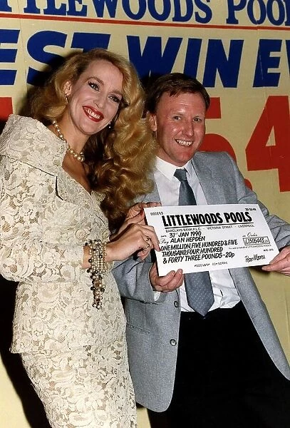 Alan Hepden Winner of 1. 5 Million Pounds is presented with the cheque by Actress Jerry
