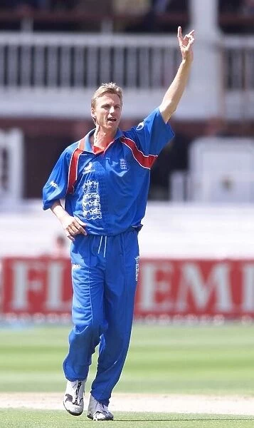 Alan Mullally celebrates taking his first wicket May 1999 for England in their