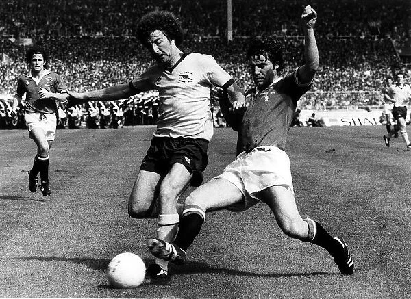 Alan Sunderland Football Player Arsenal May 1979 is tackled by Martin Buchan in
