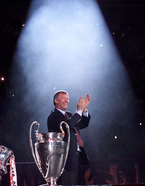 Alex Ferguson in the spotlight receiving May 1999 the cheers of the Manchester