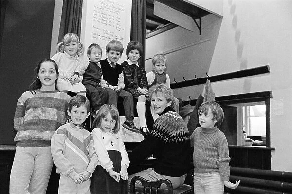 Almondbury Methodist Junior Church Christmas Party, singing carols round the piano