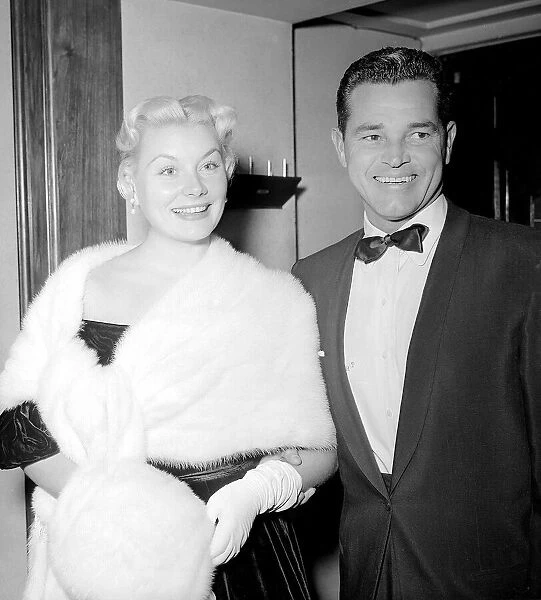 American Film Actress Barbara Payton wearing fur stole and muff at the Premiere of Film