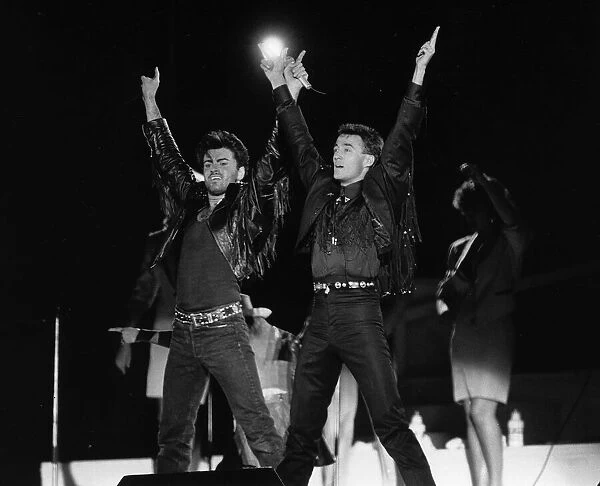 Andrew Ridgeley and George Michael of Wham 1986 pop group at farewell concert
