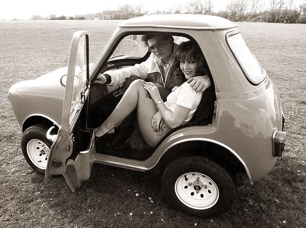 Andy Saunders and girlfriend Tina in his rebuilt mini called minihaha in Poole Dorset