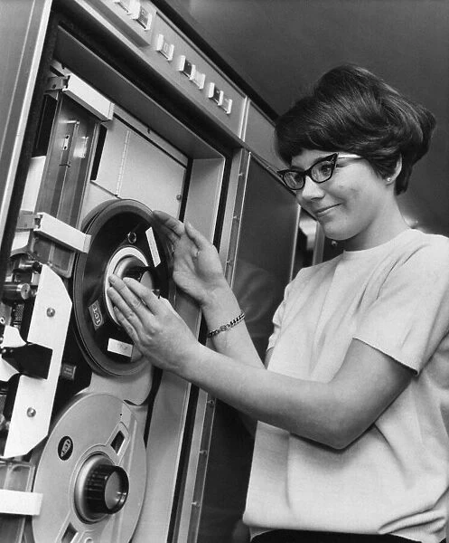 Ann Boardman aged 20, changes a tape reel on the computer, Circa 1970