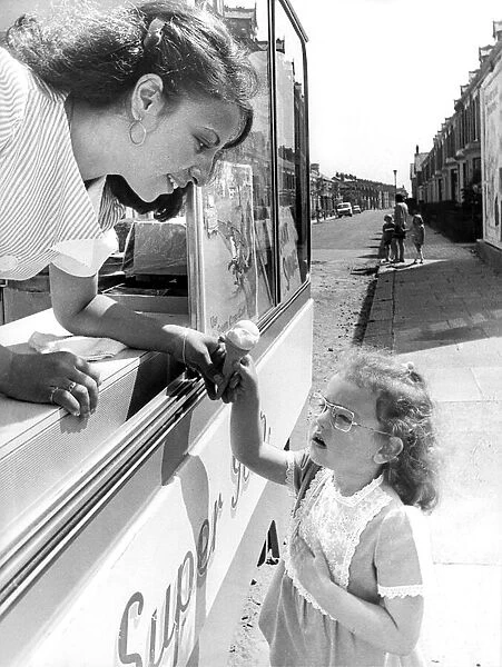 Anna Kane in her ice cream van helps little Mandy Harkness to learn the Green Cross Code