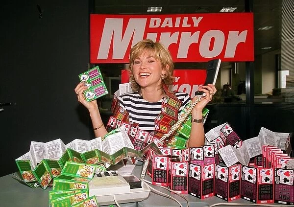 Anthea Turner TV Presenter mans the Daily Mirror National Lottery Scratchcards