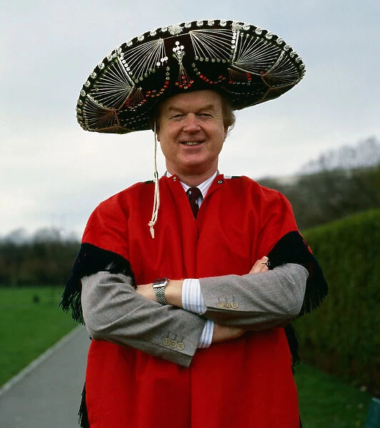 Archie McPherson Sports Commentator pictured wearing red cape and sombrero hat April 1987