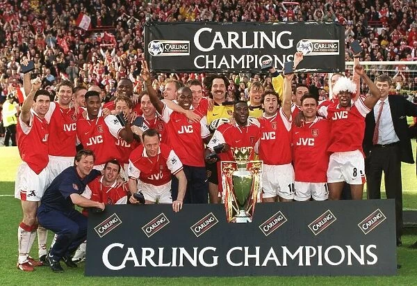 Arsenal players celebrating after beating Everton four nil at Highbury to win the Carling