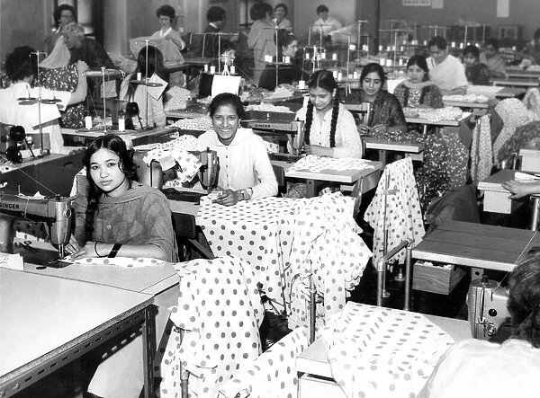 Asian girl workers at their machines in the factory of S. Levine and Co