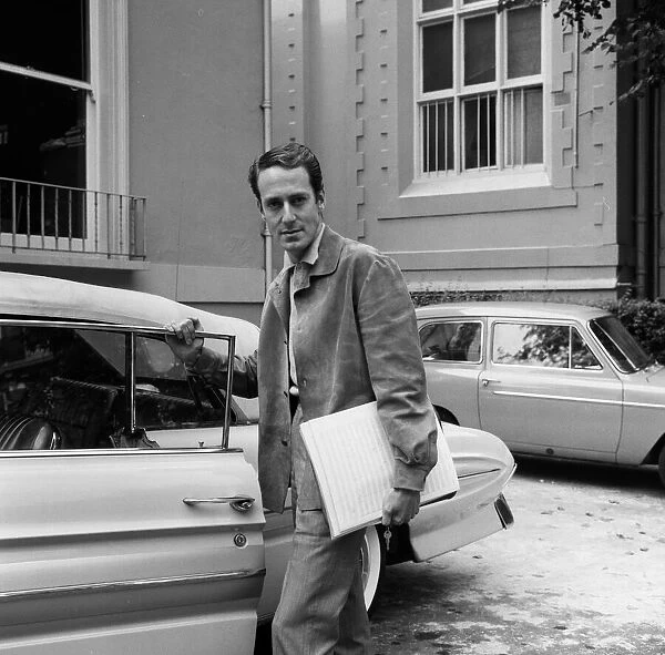Band leader, John Barry, of the John Barry Seven musical group arrives for a recording