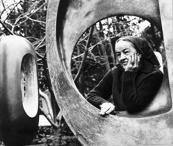 Barbara Hepworth sculptress in her garden January 1970 standing next to one of her