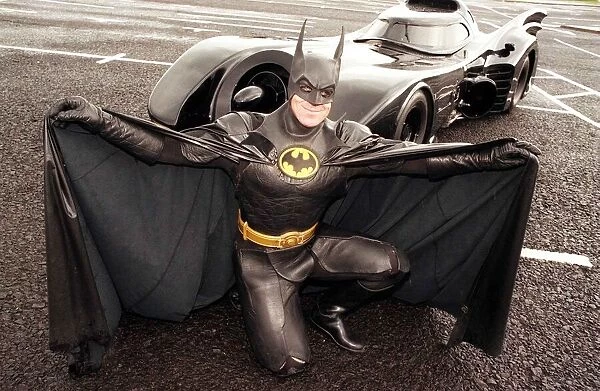 Batman car July 1998 Batman kneeling in front of car