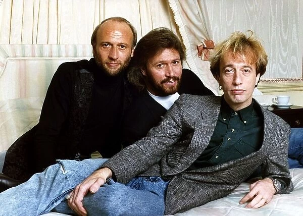 Bee Gees Pop Group brothers Maurice Gibb Barry Gibb & Robin Gibb together relax before