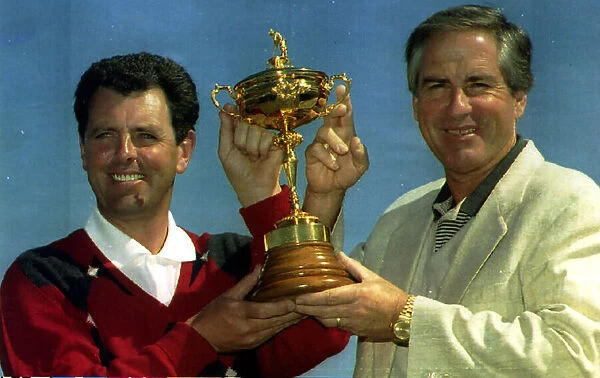 Bernard Gallacher European Ryder Cup Captain holds the trophy with Dave Stockton