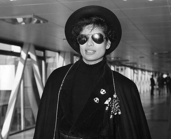 Bianca Jagger wife of Rolling Stones Mick Jagger leaving London Airport for New York