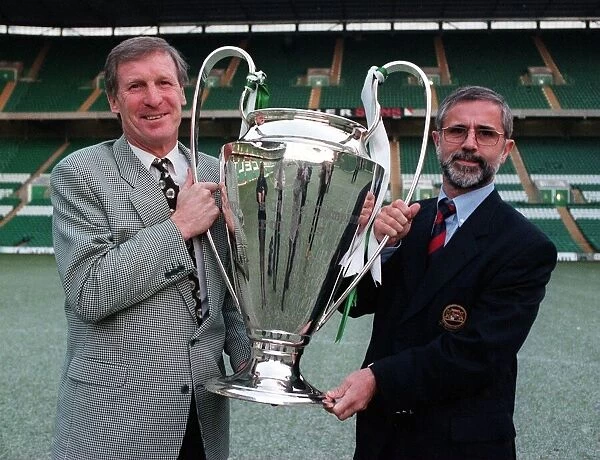 Billy McNeill and Gerd Muller holding the European Cup looking forward to the Bayern