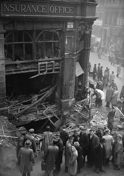 Birmingham residents inspect a bomb crater at the corner of Bennetts Hill and New Street