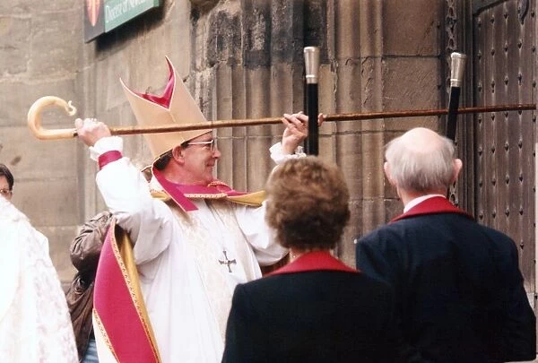 The Bishop of Newcastle, the Right Reverend Martin Wharton knocks on the doors of St