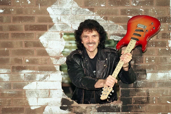 Black Sabbaths Tony Iommi helps to demolish a wall at Musical Exchanges in