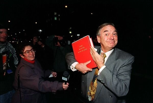 Bob Monkhouse Comedian / TV Presenter November 1996. Holding the book of gags that