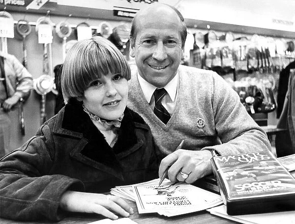 Bobby Charlton signing autographs in Binns, Newcastle in December 1982