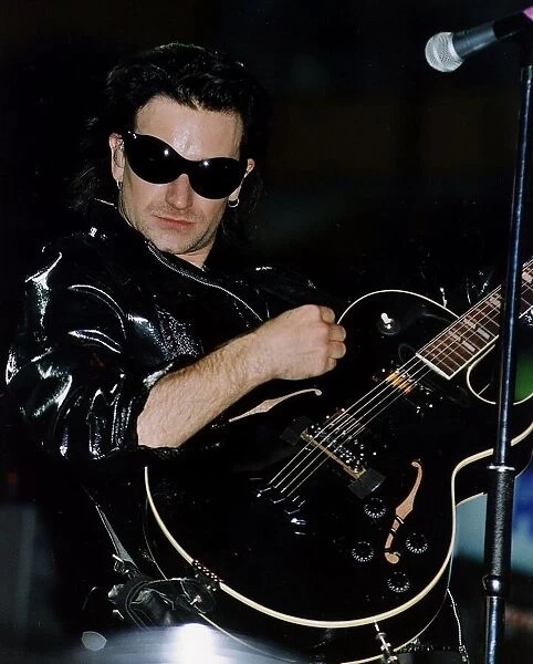 Bono of the pop group U2 performing on stage at Celtic Park in Glasgow during their ZOO