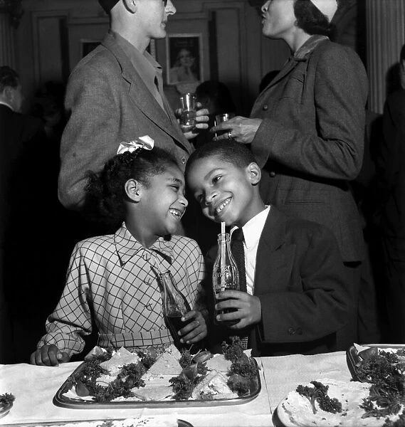 Boy and Girl aged 7 enjoy a drink and food at a reception for the cast of Porgy and Bess