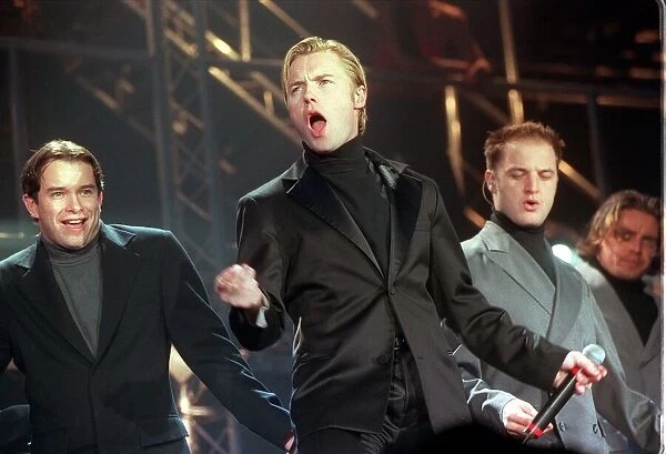 Boyzone Pop group December 1999 Ronan Keating (centre) singing with Stephen Gateley