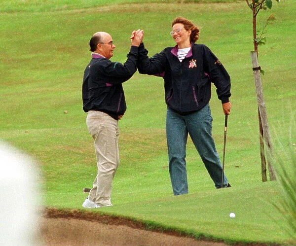 British billionaire Joe Lewis July 1997 on golf course at Turnberry Hotel high five