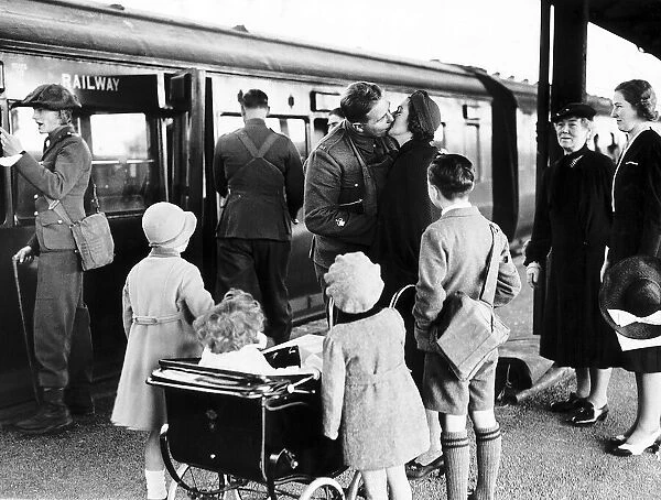 British soldier says goodbye to his family at English station